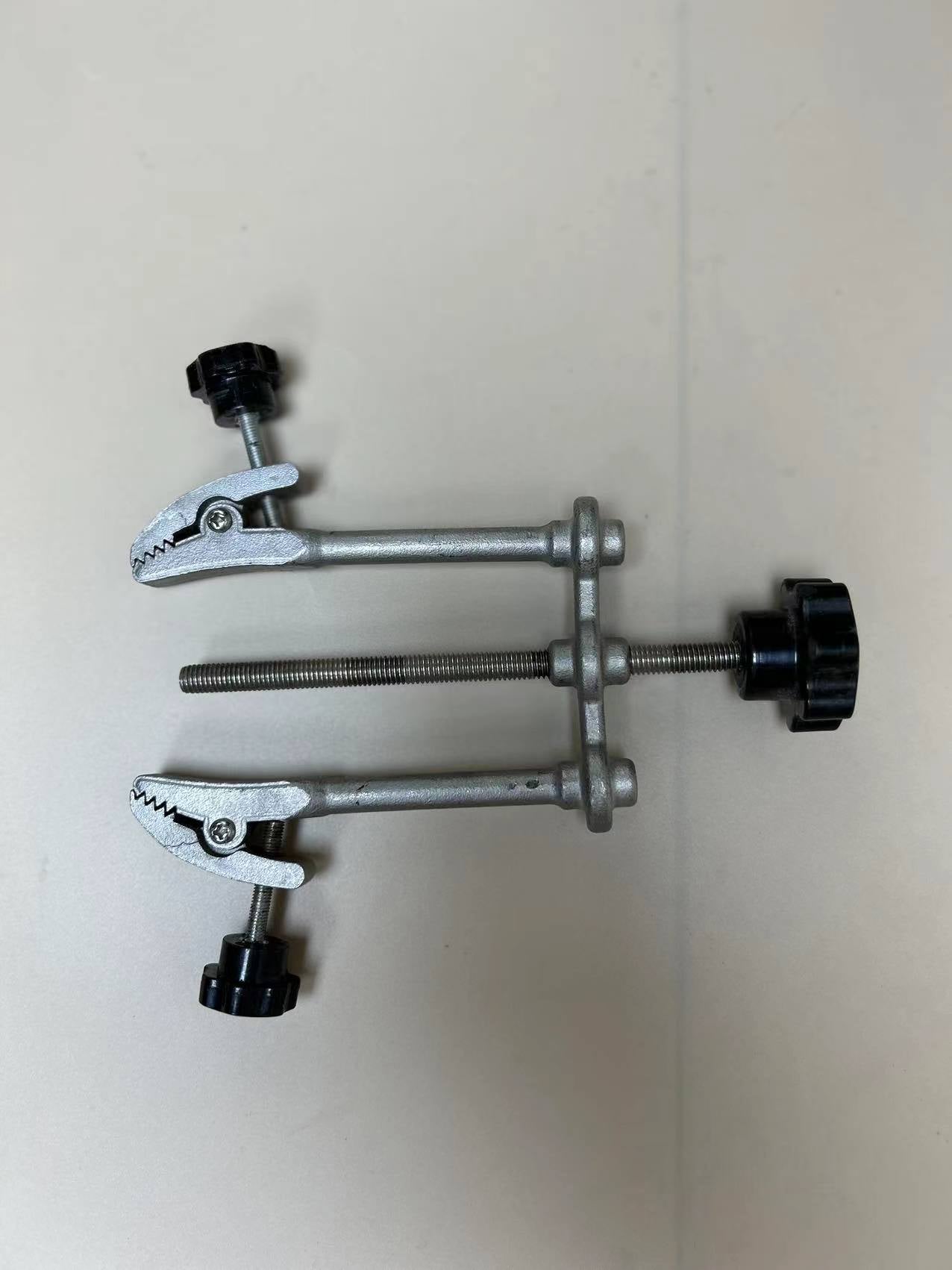 Adjustable clamp for upper crimping